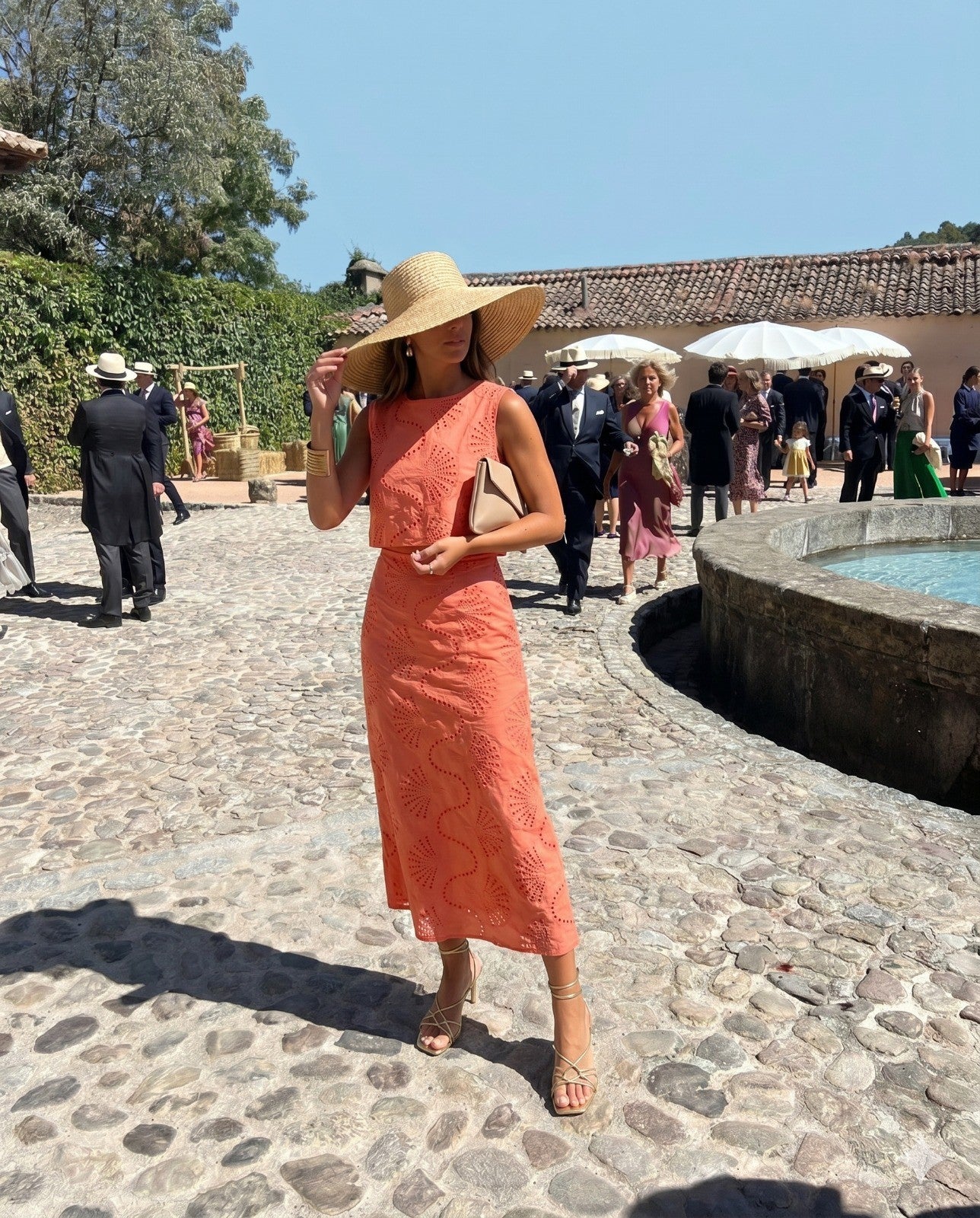 Shevibes coral embroidered eyelet sleeveless crop top and midi skirt set with straw hat.